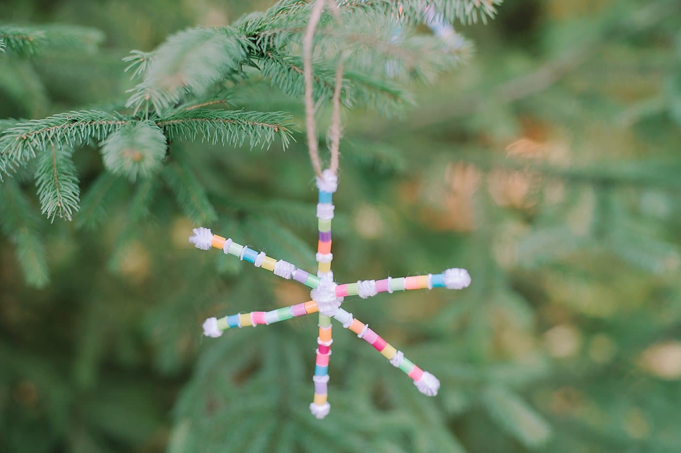 How to make perler bead pipe cleaner snowflake ornaments using white pipe cleaners and colorful perler beads.