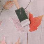Paint mod podge onto a leaf with a foam brush.