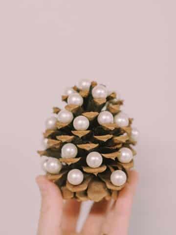 Learn how to make DIY pearl pinecone Christmas trees in this easy step-by-step craft tutorial with photos.