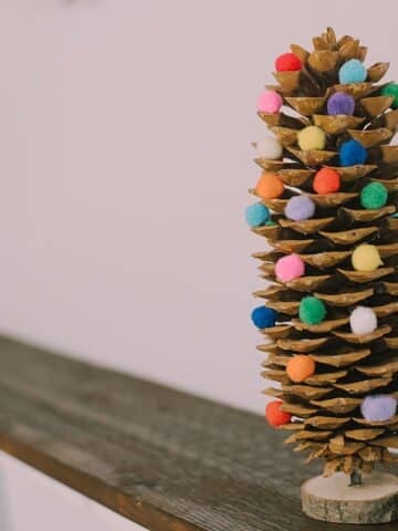 Unleash your holiday creativity! Learn how to craft a stunning DIY Giant Pinecone Christmas Tree adorned with pompoms. Get ready to spread festive cheer!