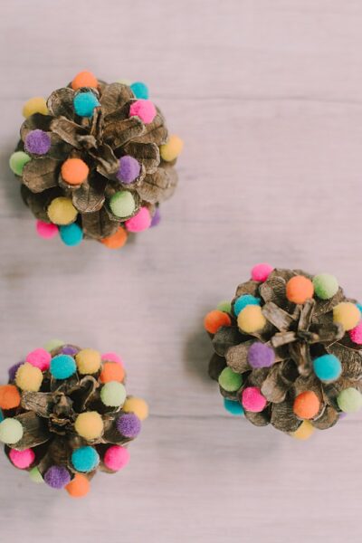 Craft Mini Pompom Pinecone Trees effortlessly with our step-by-step guide. Elevate your holiday decor with these charming DIY decorations!