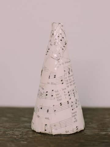 Use old book pages, maps, or church hymnal pages and Mod Podge to decorate a styrofoam cone and make it a cute addition to your home decor for any season. It's rustic chic, at its finest!