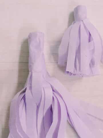 Learn how to make two sizes of tissue paper tassels in this easy step-by-step craft tutorial with photos.