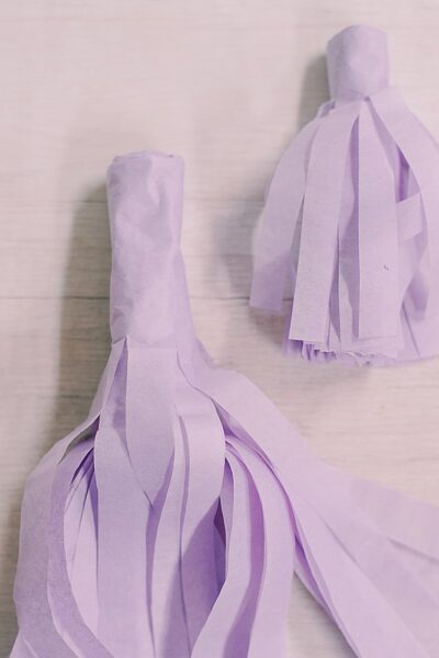 Learn how to make two sizes of tissue paper tassels in this easy step-by-step craft tutorial with photos.