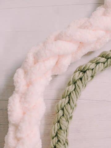 Make a stylish DIY Finger Knit Garland with chunky yarn. Create a cozy and trendy home decor piece effortlessly!
