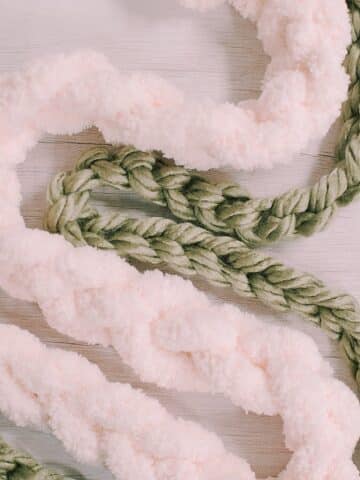 Make your own DIY Chain Stitch Garland with chunky yarn using our simple guide. Perfect for adding a cozy touch to your home decor!