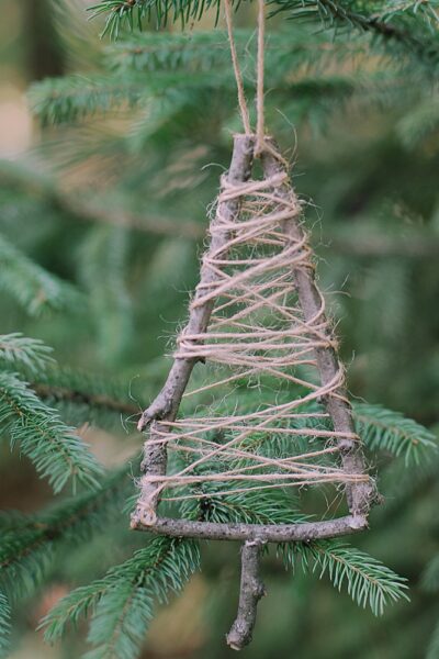 Elevate your holiday decor with a Twine-Wrapped Stick Tree Ornament. Craft it effortlessly with our step-by-step guide.