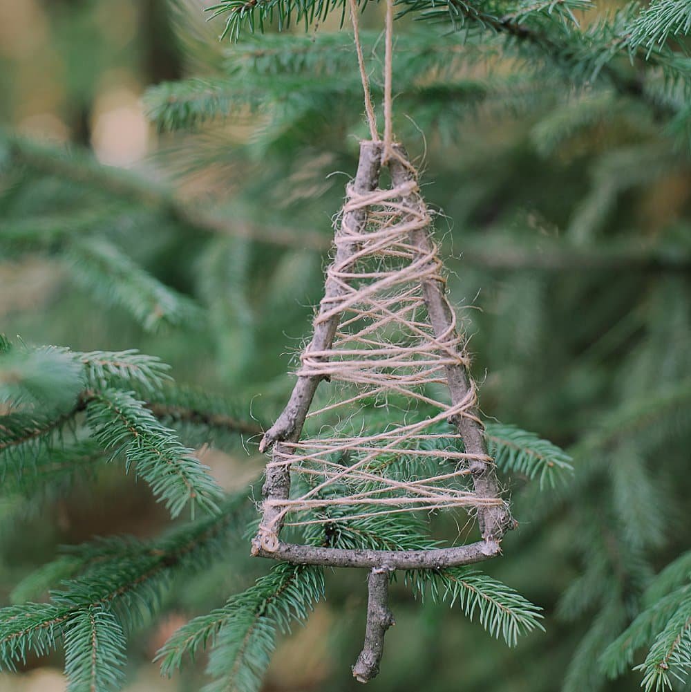 Elevate your holiday decor with a Twine-Wrapped Stick Tree Ornament. Craft it effortlessly with our step-by-step guide.