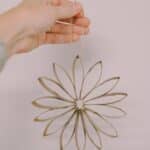 How to make flower ornaments using recycled toilet paper tubes.