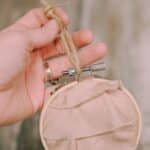 How to make a keepsake memory ornament with fabric and an embroidery hoop.