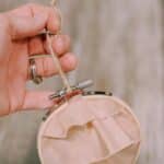 How to make a keepsake memory ornament with fabric and an embroidery hoop.