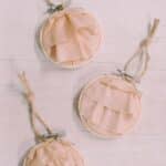 How to make a keepsake memory ornament with fabric and an embroidery hoop.