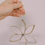 How to make flower ornaments using recycled toilet paper tubes.