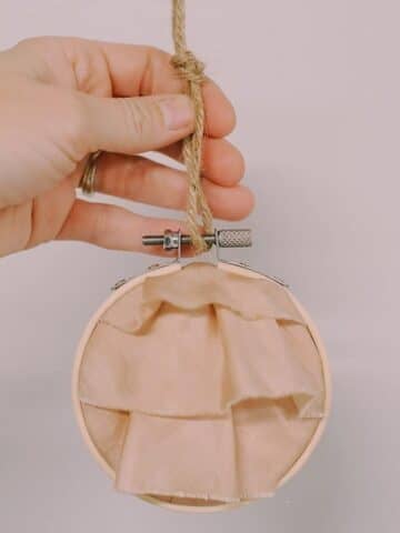 How to Make a Keepsake Memory Ornament with Fabric and Hoop.