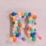 How to make a pom pom letter.
