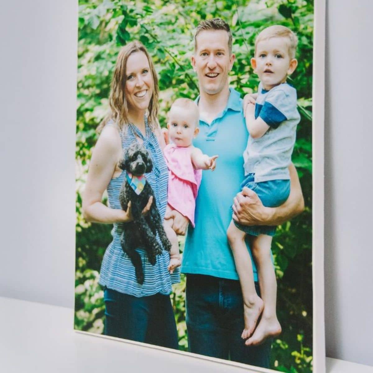 Handmade photo canvas with a photograph of a young family, made with Mod Podge.
