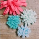 Colorful felt mums of different sizes and fringe thicknesses.