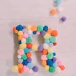 How to make a pom pom letter.