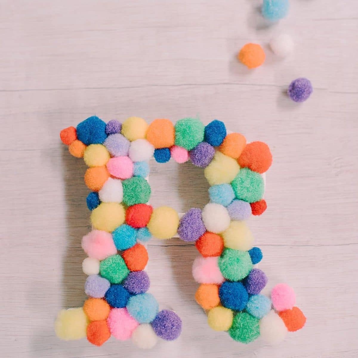 How to make a pom pom letter.